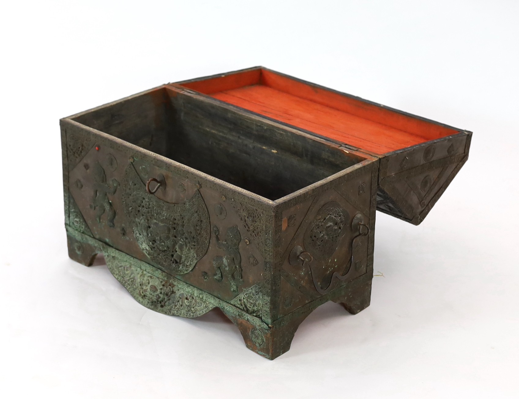 A Tibetan copper repousse-work casket, 20th century, 65cm wide, 49.5cm